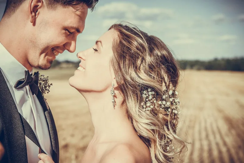 Couple sharing a quiet moment in a sunlit field